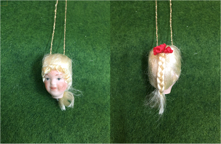 No 5 Official Porcelain Dolls head for Cross n Patch Angel patterns. Blonde hair in a plait with red ribbon. 