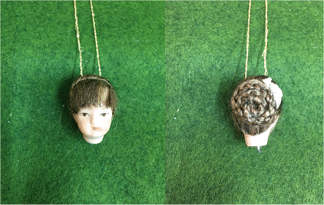 No 8 Official Porcelain Dolls head for Cross n Patch Angel patterns. Brown hair in a plaited bun with white ribbon.  