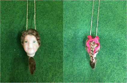 No 9 Official Porcelain Dolls head for Cross n Patch Angel patterns. Brown hair in a plait with red ribbon.   