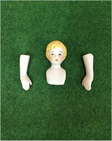 Painted Blond hair on a Porcelain Dolls head with arms 